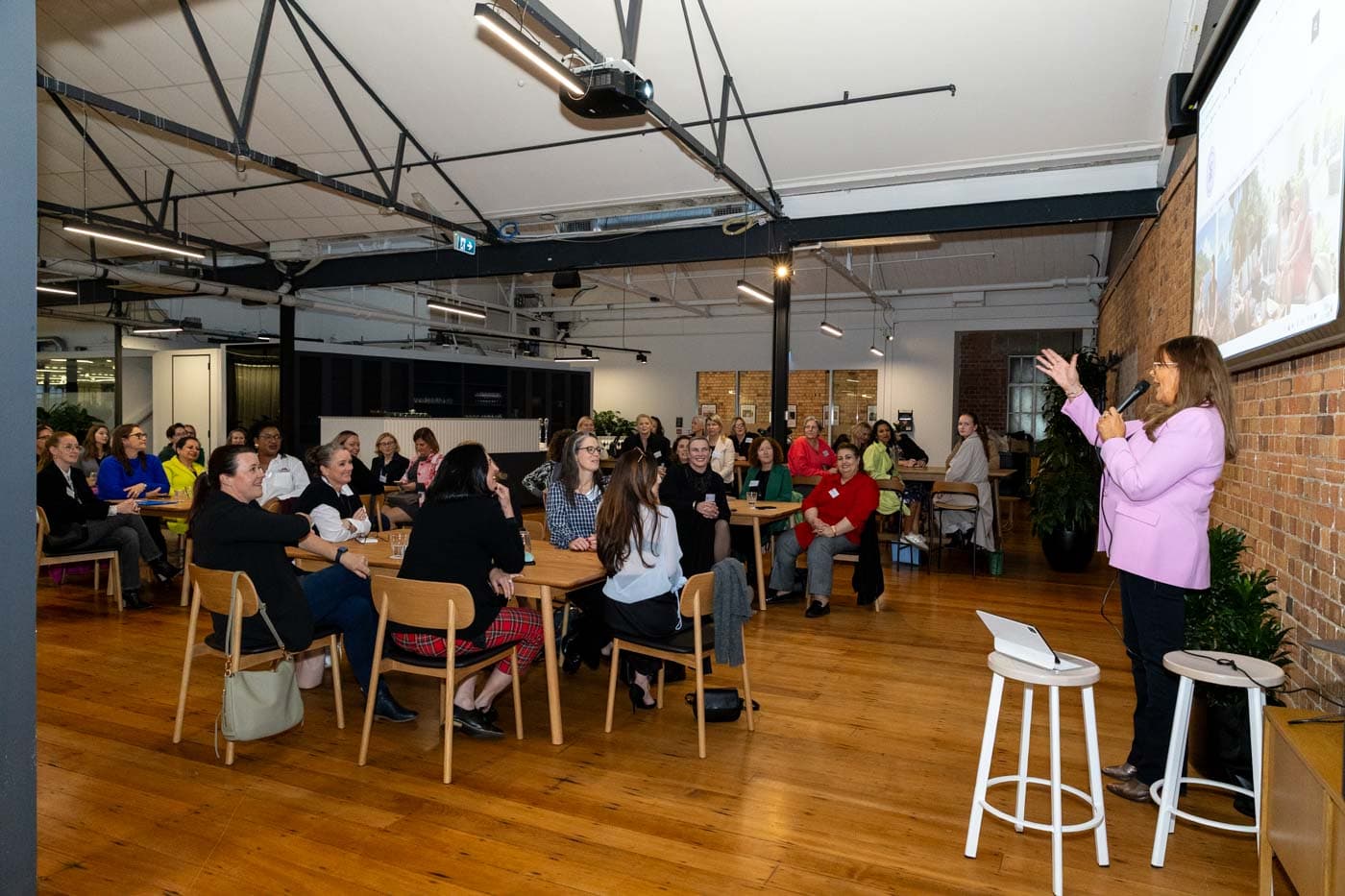 Members at an NZBW event, listening to a speaker
