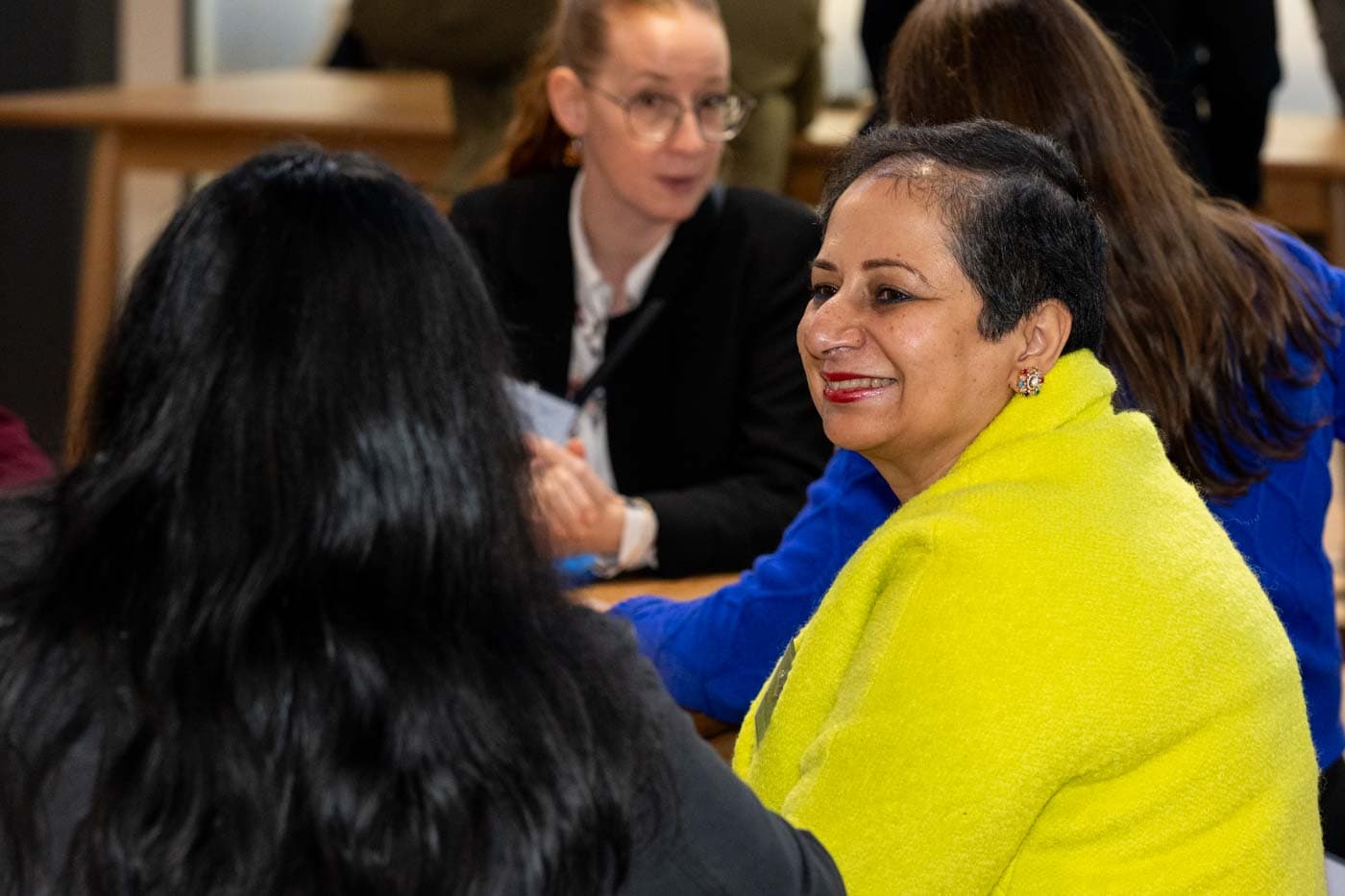 A member in conversation at an NZBW event