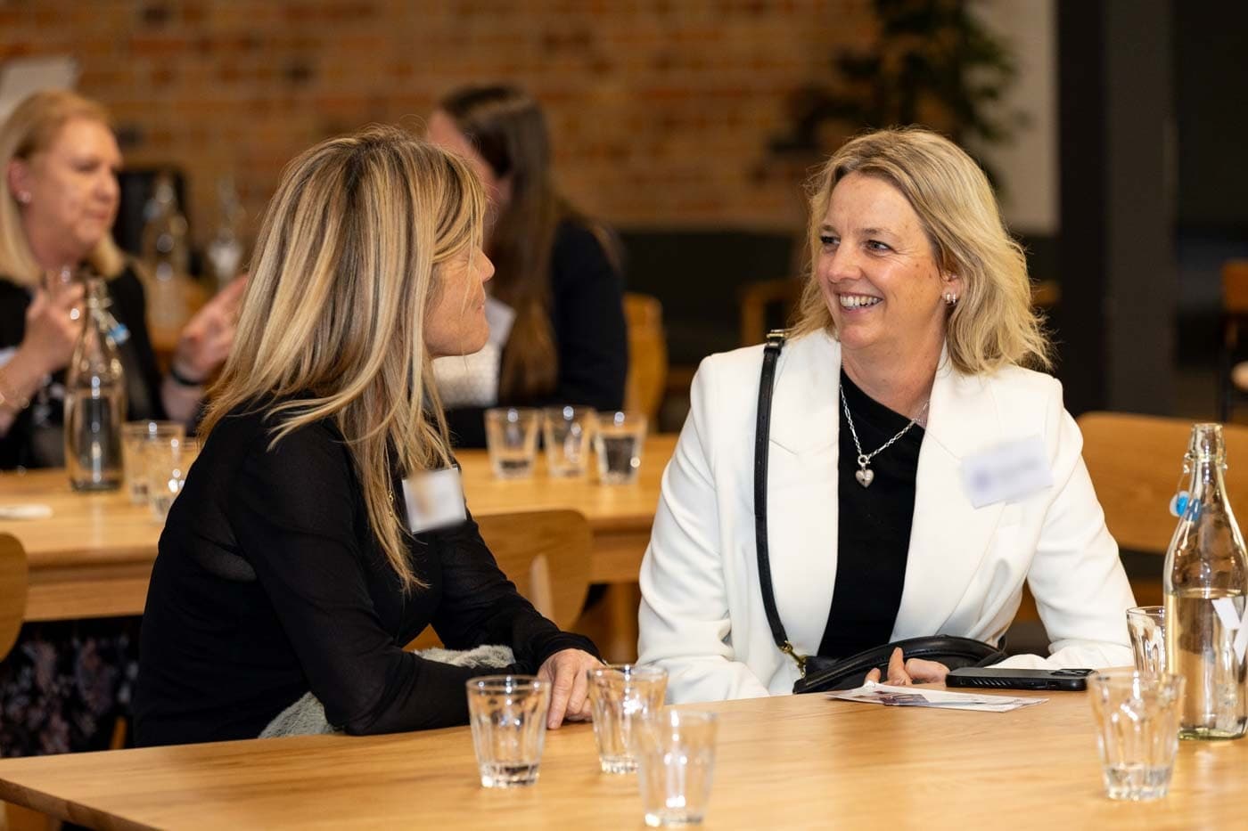 Two members talking one to one over a coffee